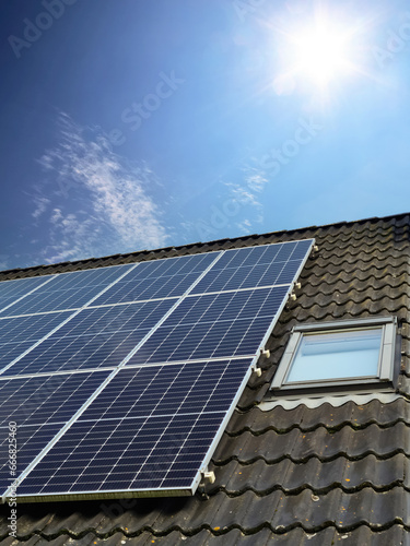 Wallpaper Mural Solar panels producing clean energy on a roof of a residential house Torontodigital.ca