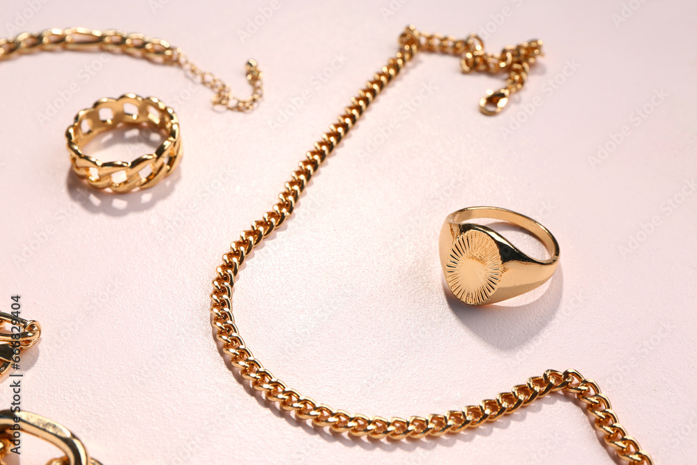 Beautiful golden jewellery on white background Beautiful golden jewellery on white background