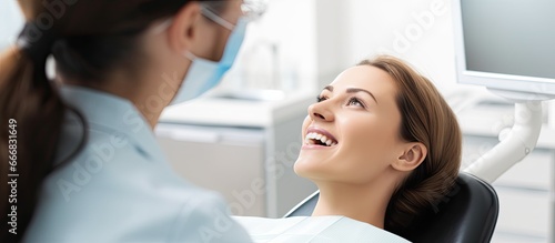 Dentist observing teeth in clinic