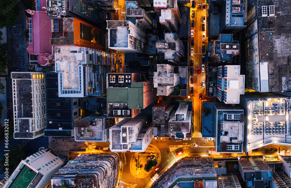 Aerial top view of downtown district buildings in night city light.