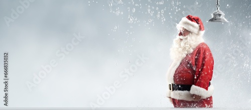 Santa Claus showering with his costume nearby
