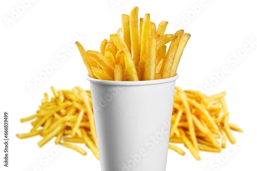 Cup of tasty hot French fries on the desk