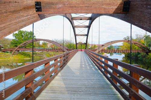 Midland's three-way 'Tridge' on a bright summer day is the symmetrical intersection of three elevated walkways on a recreation trail. photo