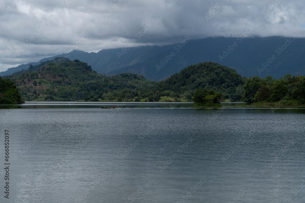 a reservoir in a small town with a view and green trees a reservoir in a small town with a view and green trees
