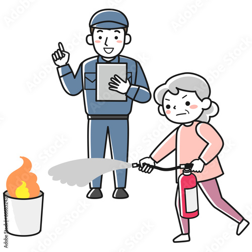 消火器を使った消火訓練をするシニア女性と消防署職員