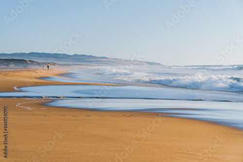 Sea waves, and clear blue sky on a sunlit day, blending tranquility and awe-inspiring nature