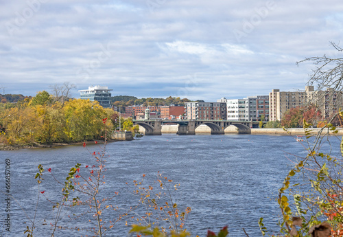 A view of the Haverhill skyline of the bridge and tall modern buildings. This small city in New England is brick and glass buildings. Haverhill Massachusetts MA during the fall and autumn with leaves