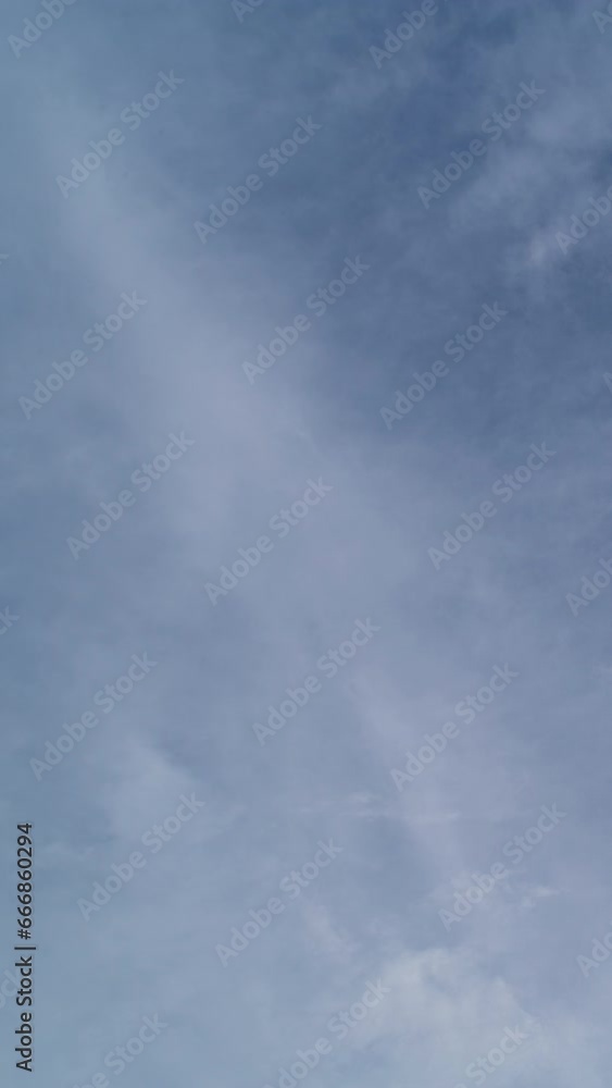 Vertical video - Timelapse of layers of clouds rolling in the sky Vertical video - Timelapse of layers of clouds rolling in the sky
