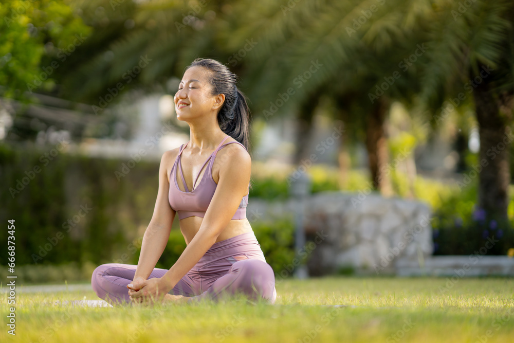 Asian woman wearing yoga clothes doing yoga at her village garden in the morning, happily, Sports healthy lifestyle concepts, Japanese concepts. Asian woman wearing yoga clothes doing yoga at her village garden in the morning, happily, Sports healthy lifestyle concepts, Japanese concepts.