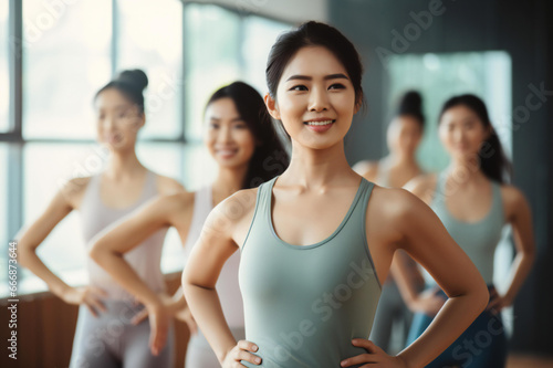 Dance class group of beautiful women dancing and enjoying workouts practicing choreography moves with an instructor in a fitness studio Modern lifestyle  happiness concept.