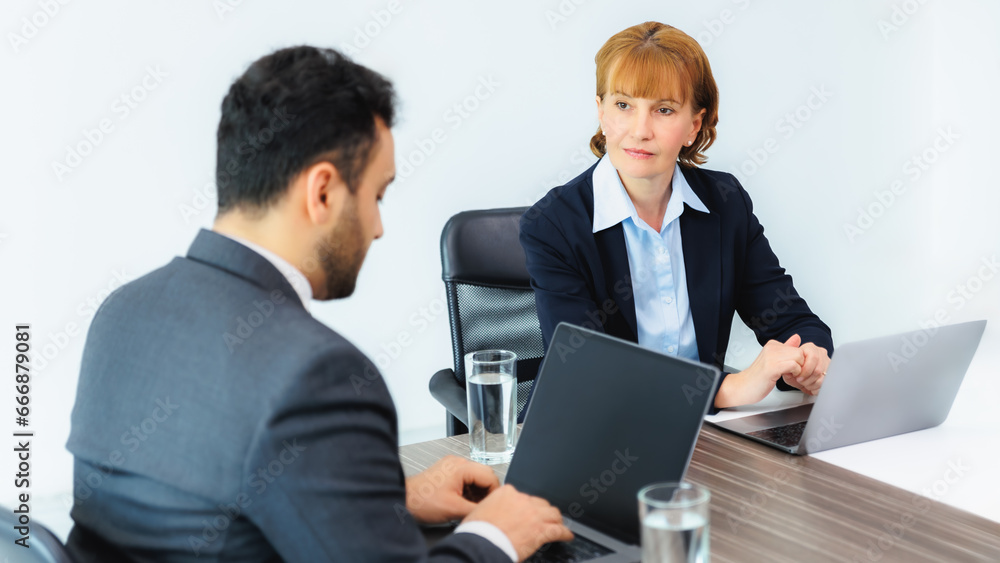 Business executive discussion with employee meeting in office. Two diverse professionals discussing project strategy and corporate plan of company Business executive discussion with employee meeting in office. Two diverse professionals discussing project strategy and corporate plan of company