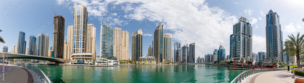 Fototapeta premium Huge high-rise buildings surround the marina in the Dubai city, United Arab Emirates