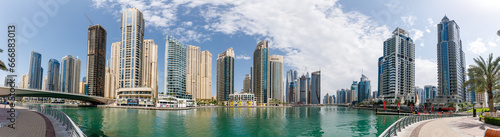 Huge high-rise buildings surround the marina in the Dubai city, United Arab Emirates
