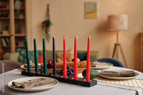 Mishumaa Saba the seven candles which represent the seven core principles of Kwanzaa on dinner table photo