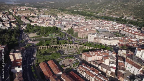 Aerial orbiting shot of Plasencia aqueduct, ancient roman structure. Spain photo