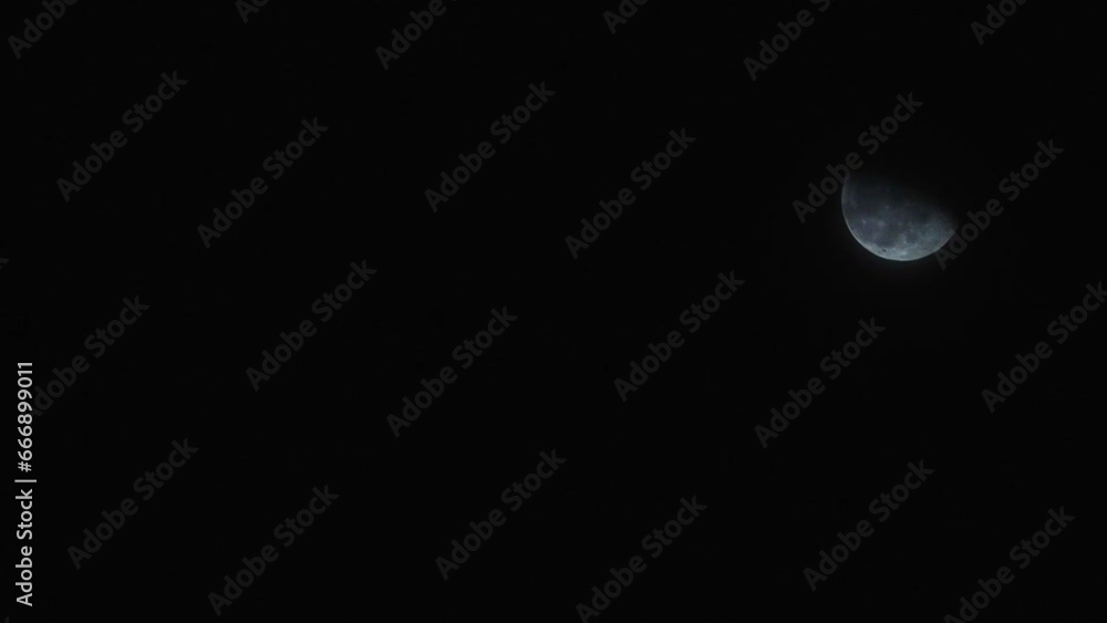 Timelapse Of Half Moon Rising In The Night Sky. Timelapse Of Half Moon Rising In The Night Sky.