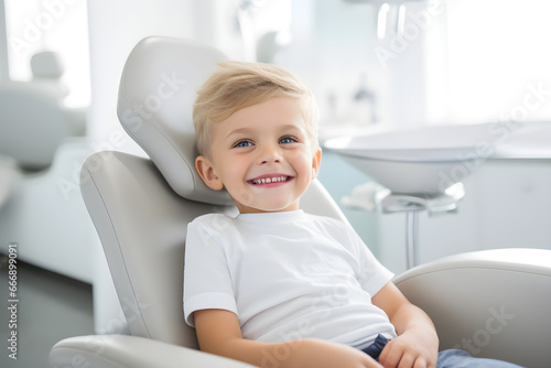 happy child sitting in dentist's chair