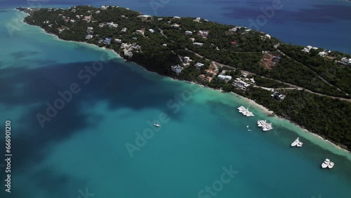 Amazing aerial view boats in water homes on mountain magen's bay st. thomas coki beach sapphire beach turquoise water waves blue sky white clouds east end red hook hills and mountains sun gleaming photo