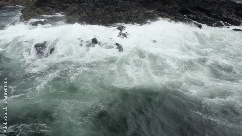 Ocean Swell HItting The Rocky Coast Of Tofino In BC, Canada. - aerial Ocean Swell HItting The Rocky Coast Of Tofino In BC, Canada. - aerial