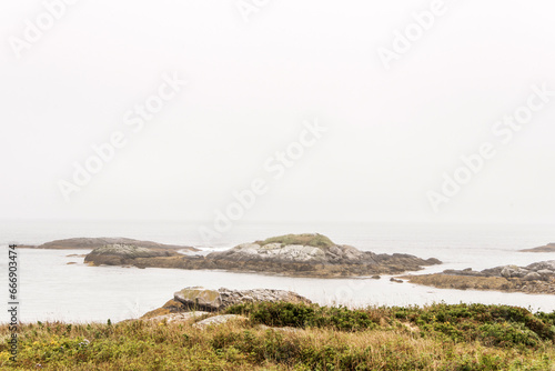 Exploring the beach in the mist morning at Kejimkujik National Park Seaside, Nova Scotia, Canada photo