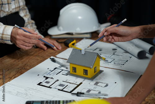 Structural engineering team discusses and calculates office interior design work, house structure concepts, construction, house models, concept meetings, business objects, real estate.