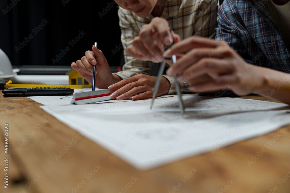 Meeting engineers or architects for projects working with partners and engineering tools on modeling. Using circles to design blueprints construction contracts between two companies structure concept Meeting engineers or architects for projects working with partners and engineering tools on modeling. Using circles to design blueprints construction contracts between two companies structure concept