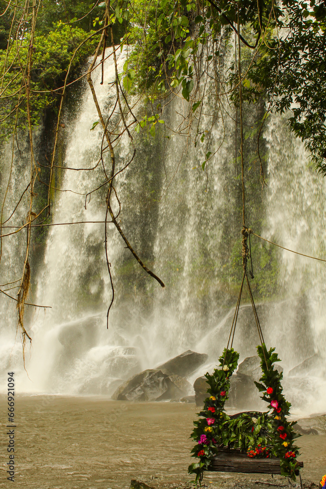 Obraz premium Vertical image of Waterfall on the Siem Reap River. Phnom Kulen, Cambodia