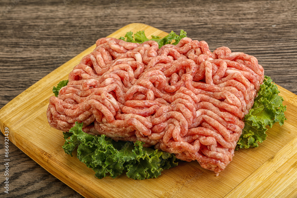 Raw pork minced meat over board Raw pork minced meat over board