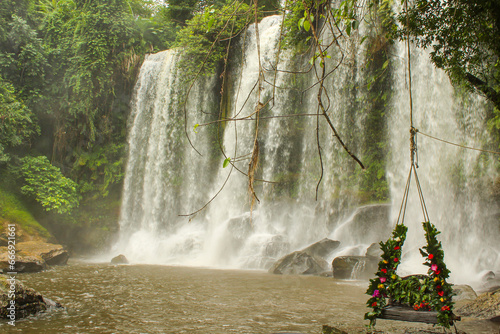 Swing at Kulen Mountain waterfall, It is the holly water photo