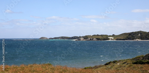 Beautiful coastal image of Rottnest Island off the West Australian coast. Showing clear water, waves, limestone rocks and vegetation