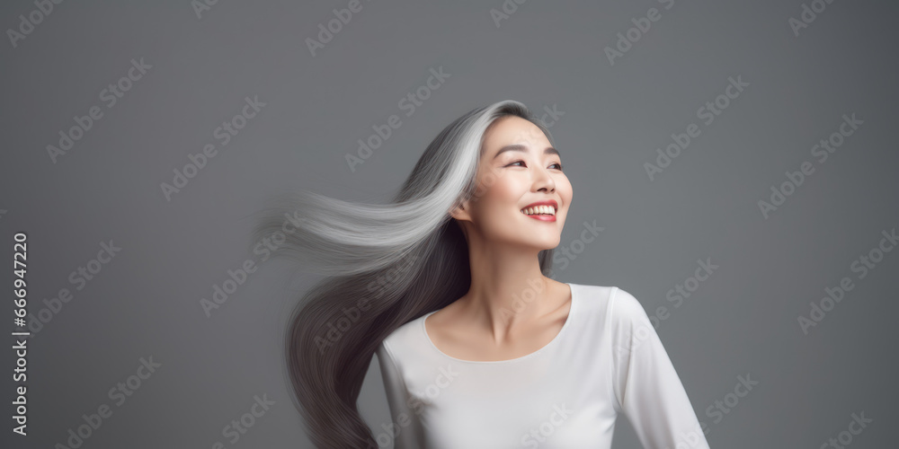 Portrait of a smiling young asian woman standing over gray background. AI Generative Portrait of a smiling young asian woman standing over gray background. AI Generative