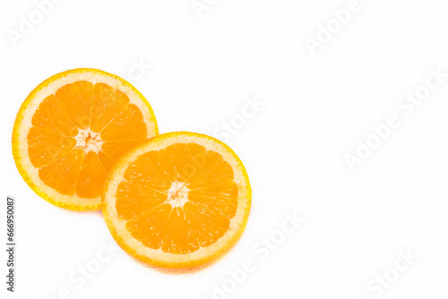 Orange cut into circles, orange fruit slices isolated on white background.