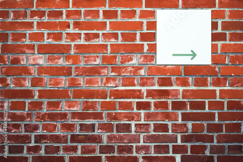 Wallpaper Mural Direction arrow sign board on brick wall facade Torontodigital.ca