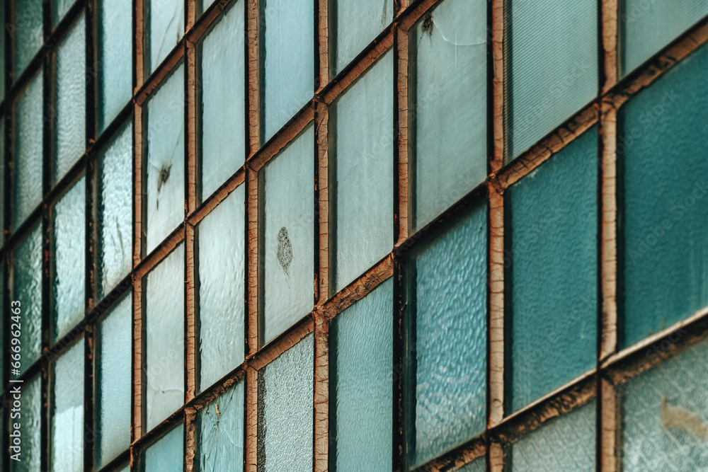 Old factory warehouse grid windows with broken glass Old factory warehouse grid windows with broken glass