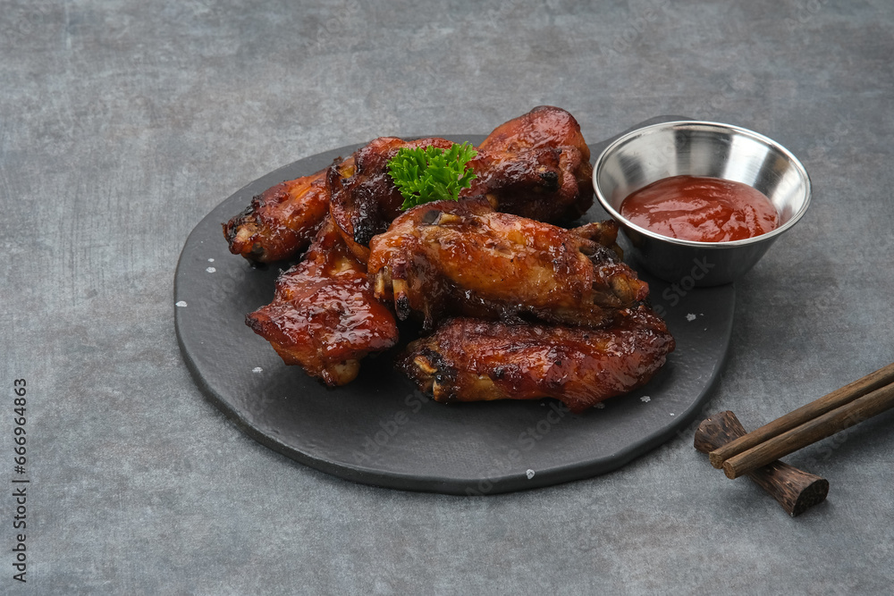 Roasted chicken wings with honey and spices 
