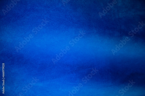 Gradient Dark blue velvet fabric texture used as background. navy color fabric background of soft and smooth textile material. crushed velvet .luxury blue tone for silk.