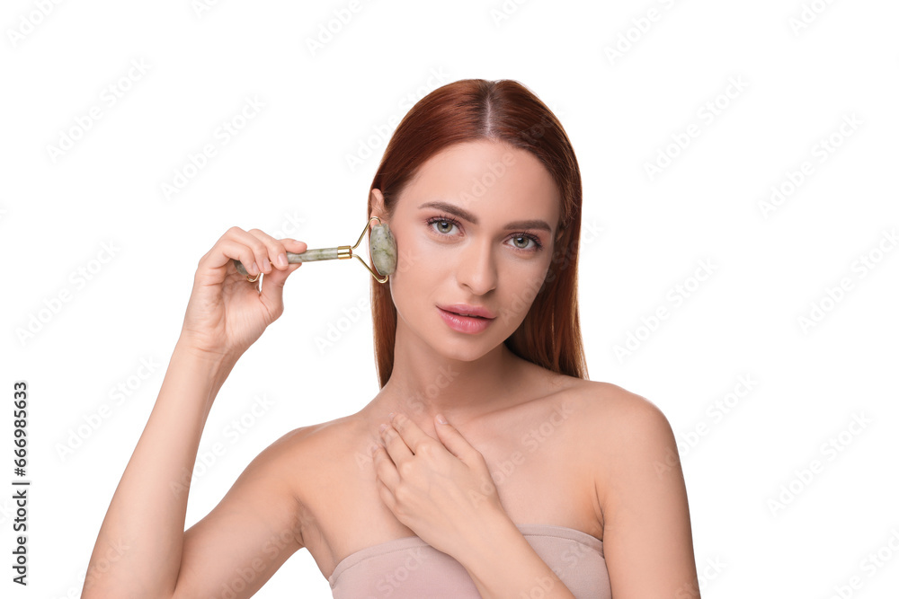 Young woman massaging her face with jade roller isolated on white Young woman massaging her face with jade roller isolated on white