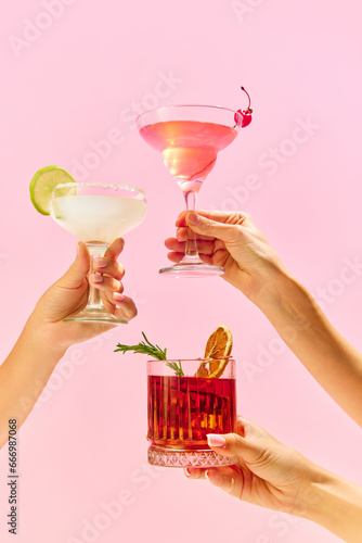 Poster. Variations of alcohol drinks. Capturing hands with funky cocktail glasses, each hosting a uniquely colorful drink, set against colorful studio background.