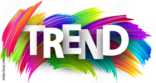 Trend paper word sign with colorful spectrum paint brush strokes over white.