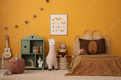 Stylish composition of child room interior with mock up poster frame, childbed, decoration, wooden block toys, plush monkey, colorful garland and personal accessories. Home decor. Template.