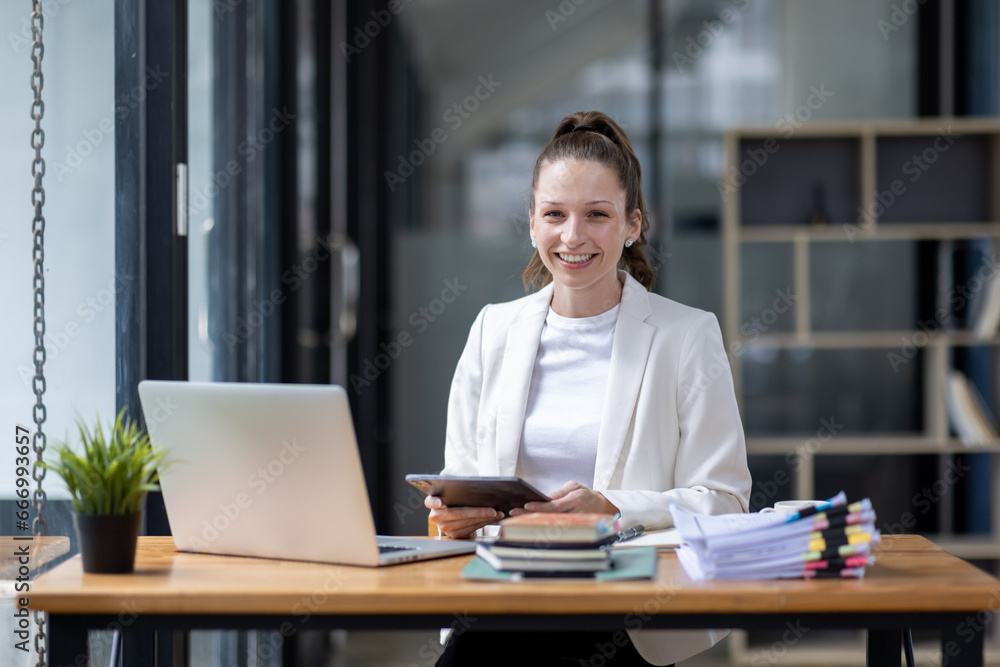 Confident millennial Canada female business analyst financial advisor preparing statistic report studying documents on work, finance analysis graph chart corporate economy, banking, market research Confident millennial Canada female business analyst financial advisor preparing statistic report studying documents on work, finance analysis graph chart corporate economy, banking, market research