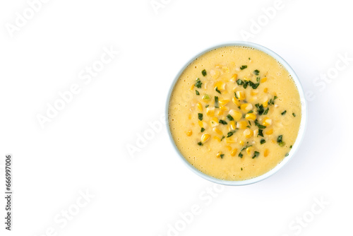 Corn soup in green bowl isolated on white background. Top view. Copy space