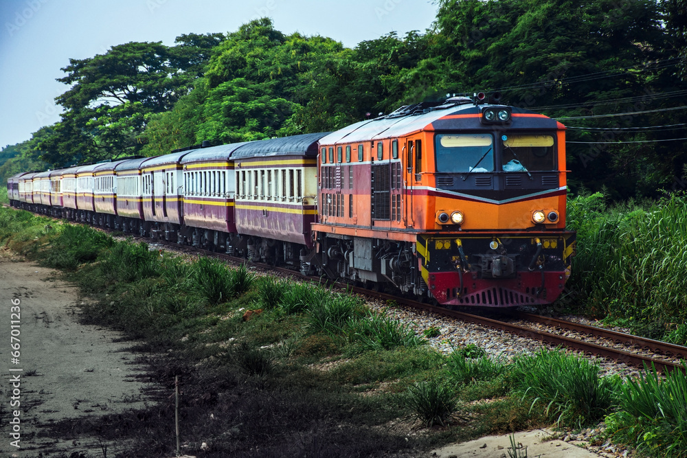 Passenger train by diesel locomotive on the railway. Passenger train by diesel locomotive on the railway.