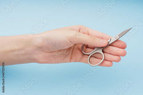 Metal scissors on a white background. Nail scissors isolated on white background. Tools for manicure and pedicure.