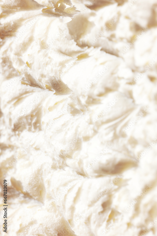 Close-up of delicious, sweet, organic cream with textured waves. Sweet cream for cakes and desserts. Concept of food, breakfast, healthy eating and snacks, organic, homemade products Close-up of delicious, sweet, organic cream with textured waves. Sweet cream for cakes and desserts. Concept of food, breakfast, healthy eating and snacks, organic, homemade products