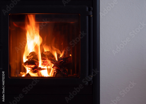 modern wood stove home heating with fire