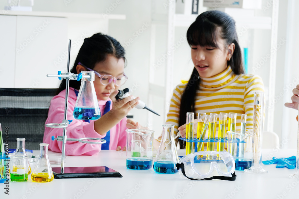 Girl doing science test in laboratory. Girl doing science test in laboratory.
