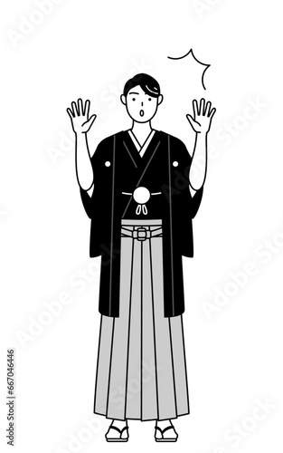 驚いて手を上げる紋付袴姿の男性