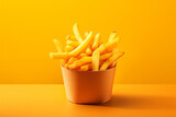 french fries in a paper box on a monochromatic background