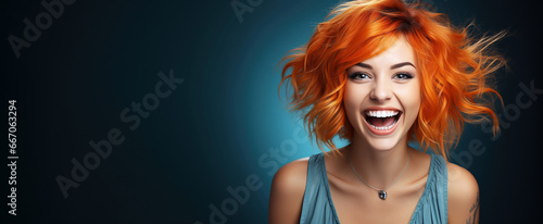 happy surprised red-haired young woman on a blue background with a copy space